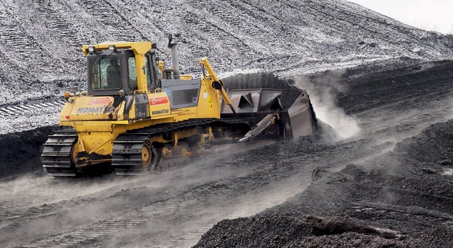 Bulldozer pushing coal in Ljubljana Power Station