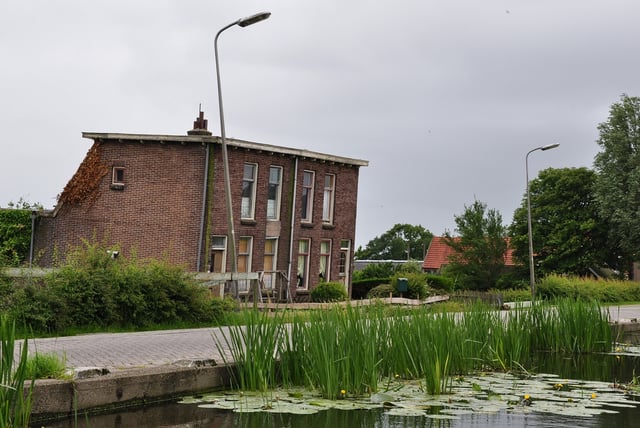 Inadequate foundations in muddy soils below sea level caused these houses in the Netherlands to subside.