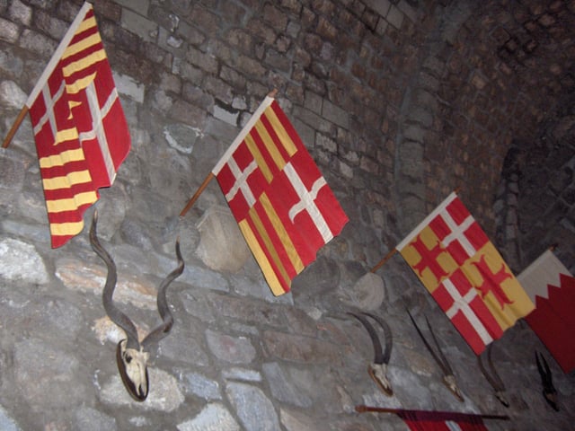 Flags of Knights Hospitaller in Saint Peter's Castle, Bodrum, Turkey.Left to right: Fabrizio Carretto (1513–1514);Amaury d'Amboise (1503–1512);Pierre d'Aubusson (1476–1503);Jacques de Milly (1454–1451).