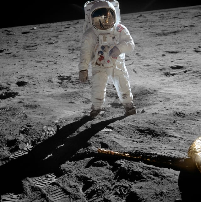 Aldrin poses on the Moon, allowing Armstrong to photograph both of them using the visor's reflection