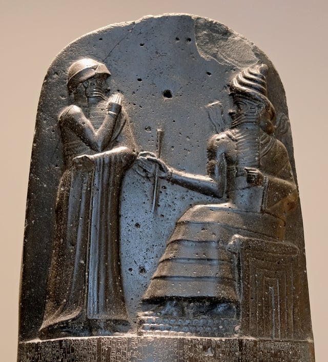 Hammurabi, depicted as receiving his royal insignia from Shamash. Relief on the upper part of the stele of Hammurabi's code of laws.