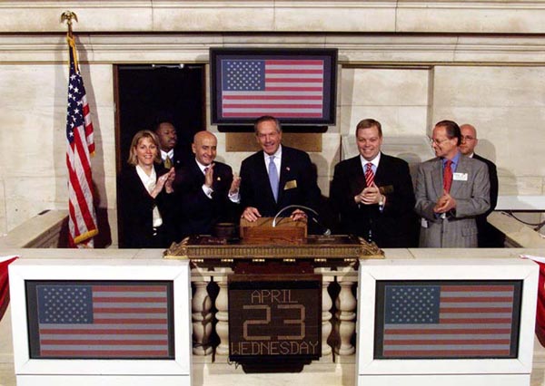 U.S. Secretary of Commerce Donald L. Evans rings the 'opening bell' at the NYSE on April 23, 2003. Former chairman Jack Womack is also in this picture.