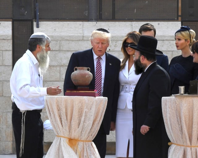 Trump (far right) with her husband and her father at the Western Wall at Temple Mount in Jerusalem in May 2017