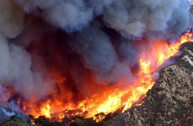 Wildfire in the Simi Hills, 2003. U.S. Air Force C-130 Hercules pilots flew eight C-130 cargo airplanes and dropped 129,600 gallons of retardant on the fire.