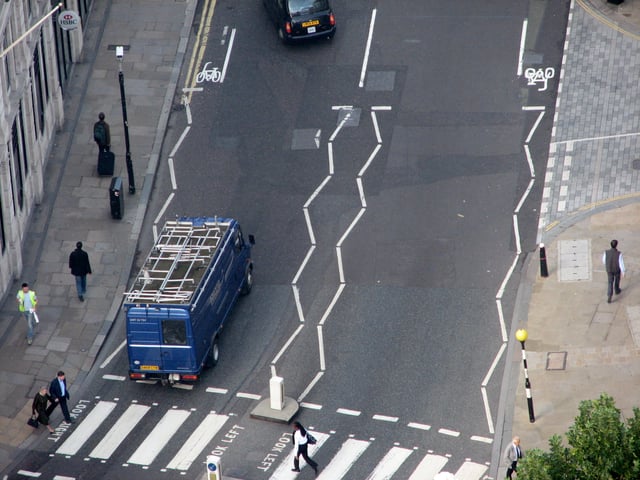 Pedestrian crossing, line markings and street furniture.