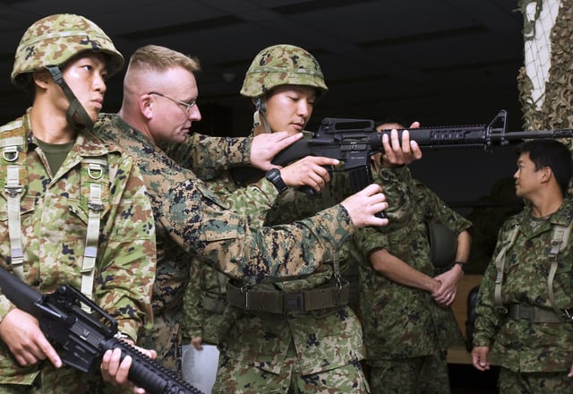 Two JGSDF soldiers training with their M16A4 rifles