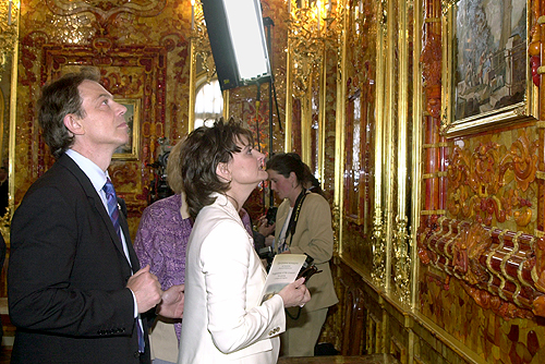 Blair with wife, Cherie Booth, touring the Amber Room during a visit to Russia, 2003.