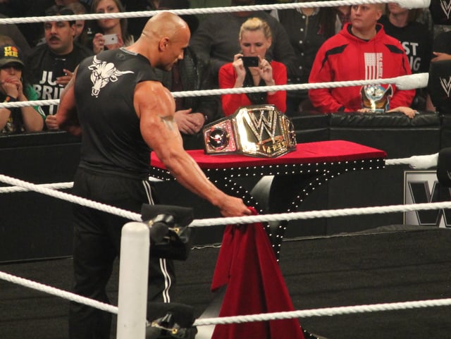 The Rock revealing the brand new WWE Championship design in 2013