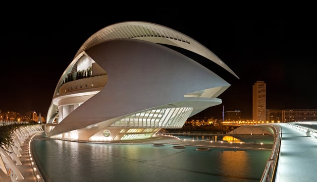 Palau de les Arts Reina Sofía in València, Spain, photographed at night with the city in the background