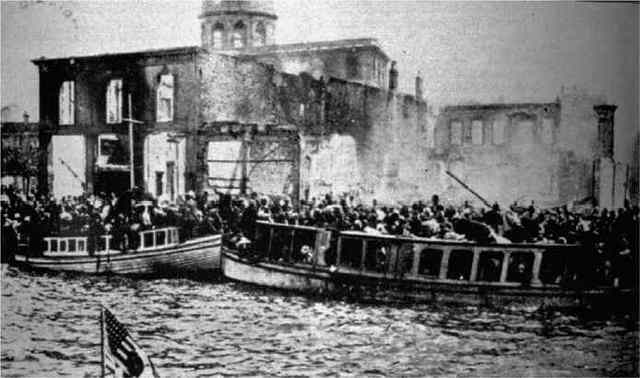 Overcrowded boats with refugees fleeing the Great fire of Smyrna. The photo was taken from the launch boat of a US warship.
