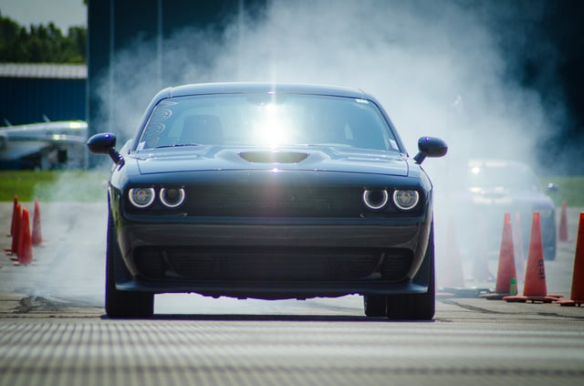 Dodge Challenger Hellcat rolling down the dragstrip