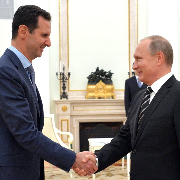 Assad greeting Russian President Vladimir Putin, 21 October 2015