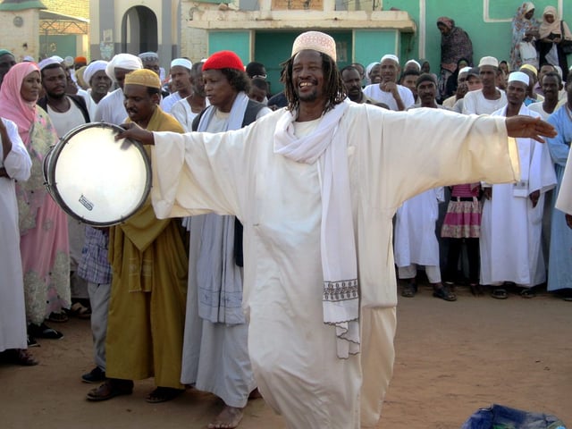 A Sufi dervish drums up the Friday afternoon crowd in Omdurman.