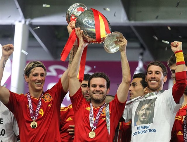 Torres (left) celebrating with Spain teammates Juan Mata and Sergio Ramos after winning UEFA Euro 2012
