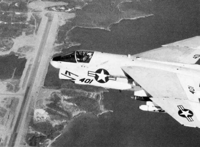 A VA-87 A-7E from USS Independence over Port Salines airfield
