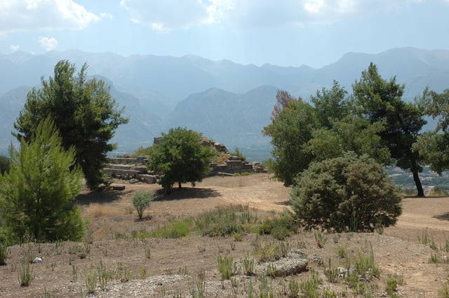 Hollow Lacedaemon. Site of the Menelaion, the ancient shrine to Helen and Menelaus constructed in the Bronze Age city that stood on the hill of Therapne on the left bank of the Eurotas River overlooking the future site of Dorian Sparta. Across the valley the successive ridges of Mount Taygetus are in evidence.