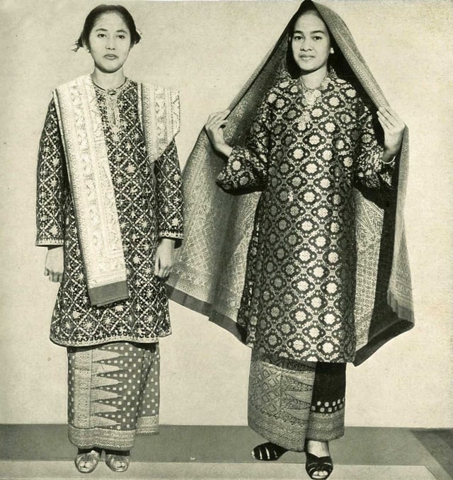 Ladies from Sumatra clad in their traditional attire, known as Baju Kurung made from Songket. The dress is commonly associated with women of Malay extraction.