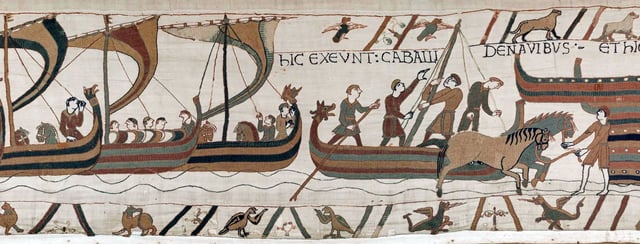 Landing in England scene from the Bayeux Tapestry, depicting ships coming in and horses landing