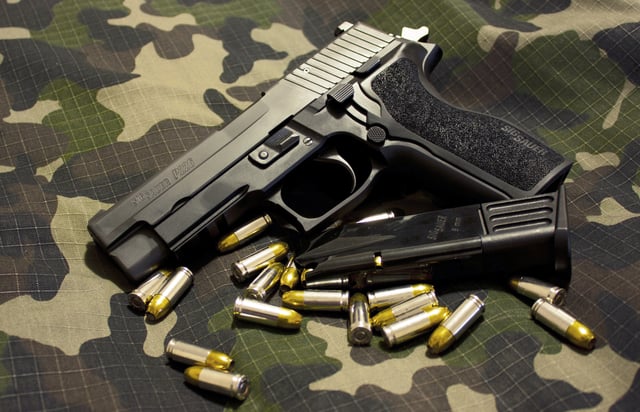 SIG Sauer P226 E2. Note magazine capacity in this picture is capped at 10 rounds.