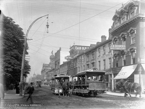 Horse-drawn streetcars in 1890. The city's streetcar system transitioned to electric-powered streetcars in 1892.