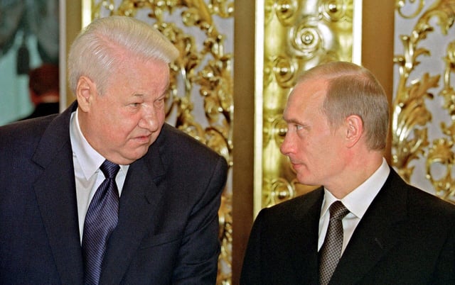 President Vladimir Putin with former President Boris Yeltsin on 12 June 2001