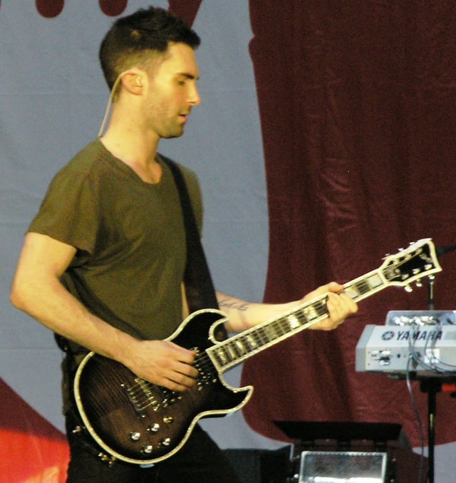 Levine playing the First Act 222 Guitar, which he helped design