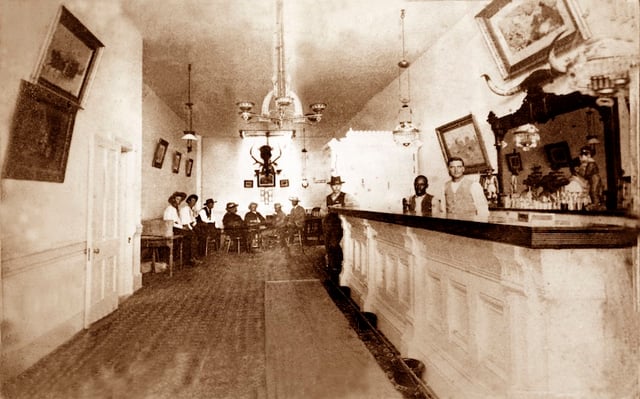Photograph of the actual interior of the real-life Long Branch Saloon in Dodge City, Kansas, taken between 1870 and 1885