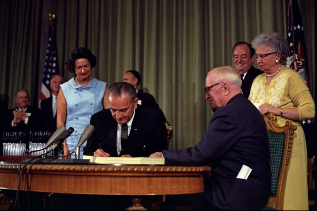 Former president Truman and wife Bess at Medicare Bill signing in 1965, as Lady Bird and Hubert Humphrey look on