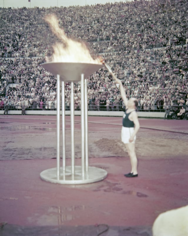 Nurmi lights the Olympic Flame in 1952
