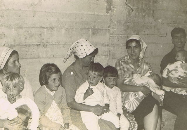 People in a bomb shelter at Kfar Maimon