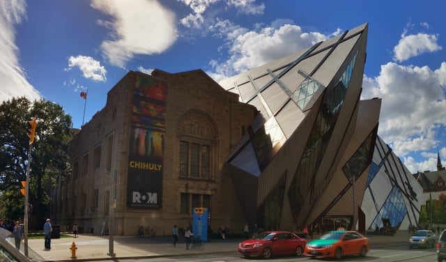 The Royal Ontario Museum was originally designed in a Romanesque Revival style, although other styles were since been added to the building. Architecture in Toronto has been called a "mix of periods and styles".