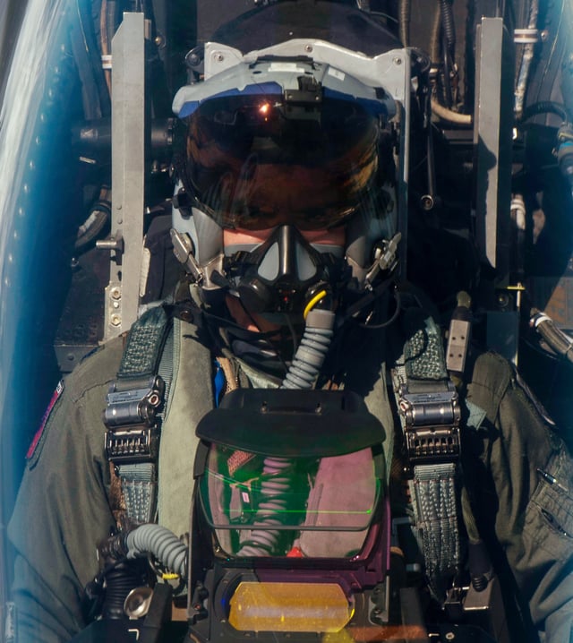 F-16 pilot with Joint Helmet Mounted Cueing System and cockpit head-up display