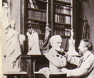 Bartholdi sculpting. To the left is a miniature of Liberty Enlightening the World.