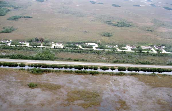 A 2003 U.S. Geological Survey photo showing the border between Water Conservation Area 3 (bottom) with water, and Everglades National Park, dry (top)