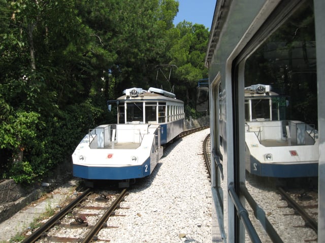 A cable tractor assisting a tramcar on the cable section of the Opicina Tramway in Trieste, Italy.