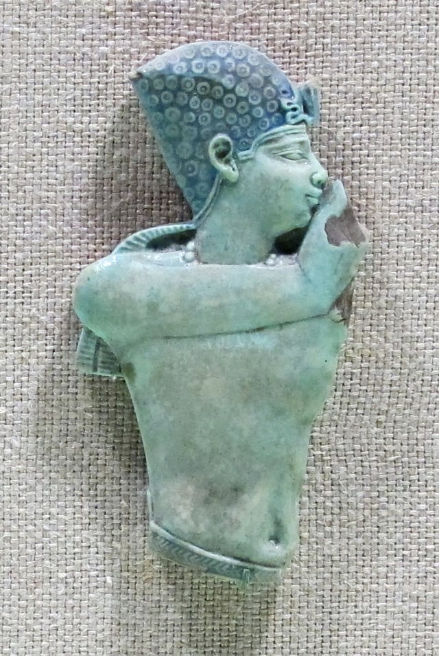 Egyptian faience torso of a king, for an applique on wood