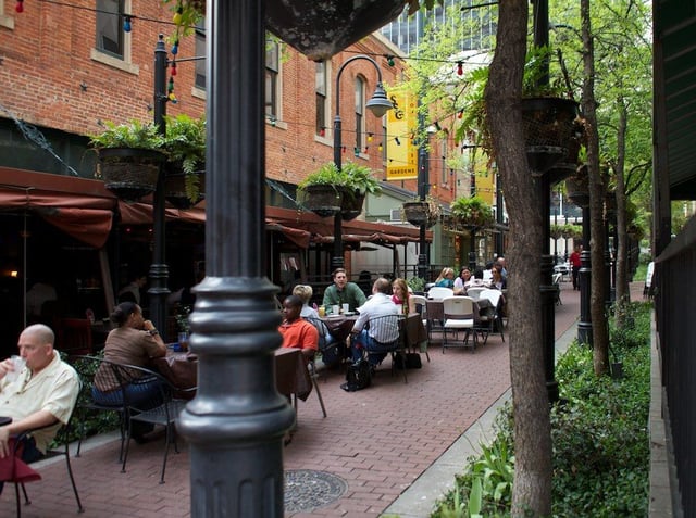 Stone Street Gardens is lined with bistros, pubs, and restaurants connecting Main to Elm Streets in Downtown Dallas.