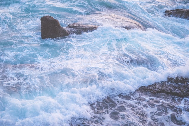 Waves by Goff Cove in Laguna Beach at sunset.