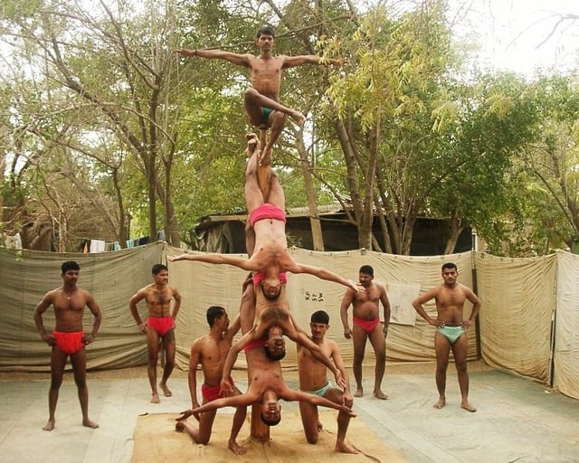 A mallakhamba team of the Indian Army's Bombay Sappers performs on the pole.