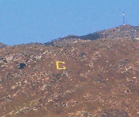 In August 1955, students constructed a 132 ft (40 m) by 70 ft (21 m) concrete "C" on the western slope of the Box Springs Mountain.