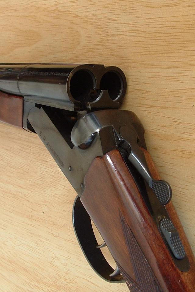 A view of the break-action of a typical double-barrelled shotgun, shown with the action open
