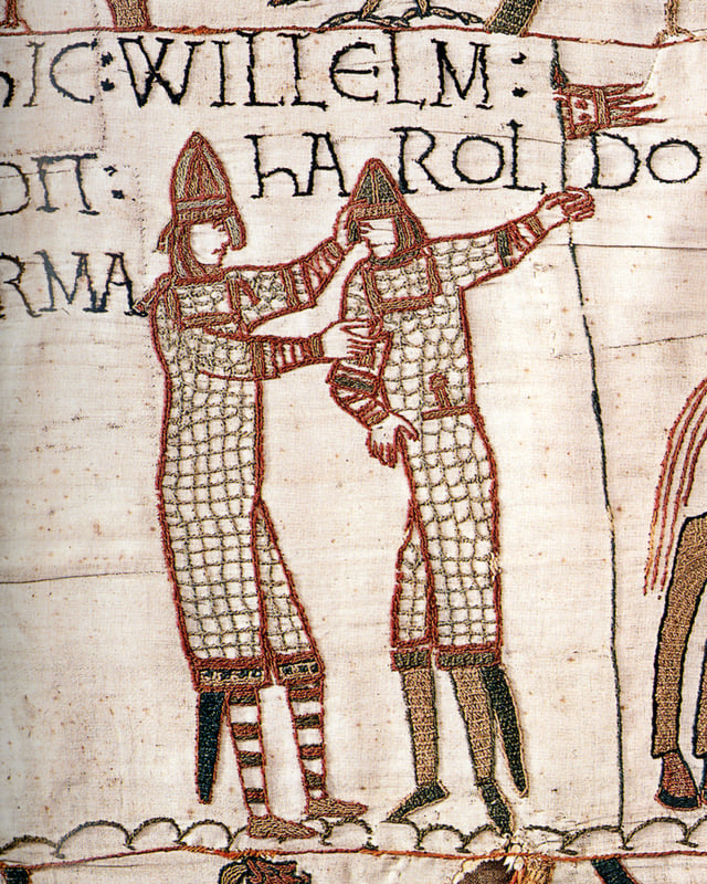 Scene from the Bayeux Tapestry whose text indicates William supplying weapons to Harold during Harold's trip to the continent in 1064