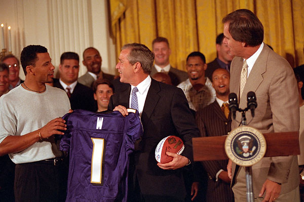The Ravens meet President George W. Bush in 2001. Bush is at center. On the left is Rod Woodson, and on the right is Brian Billick.