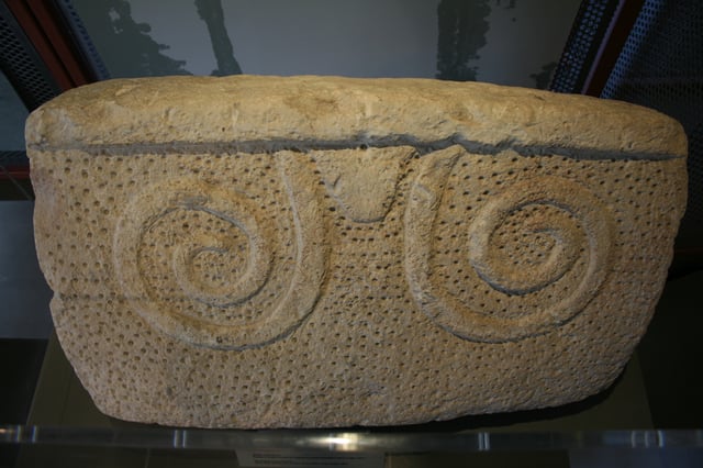 Globigerina limestone "slab with spiral and drilled decoration."