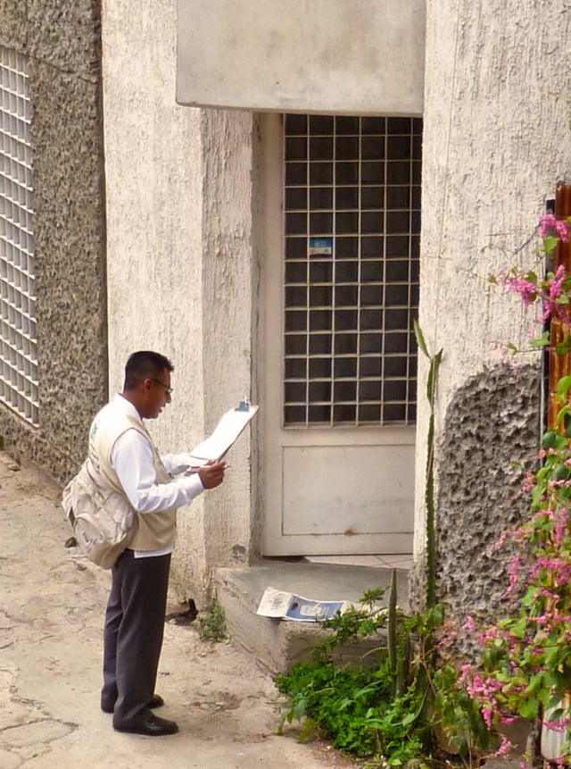 An INEGI employee going door-to-door gathering Census information in Oaxaca de Juárez.