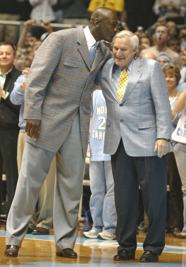 Michael Jordan (left) played basketball under Dean Smith (right) while attending the University of North Carolina. Jordan helped the Tar Heels win the 1982 NCAA Championship with a game-winning jump shot.