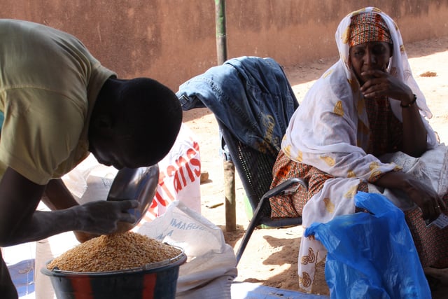 A woman waiting for food aid at a World Food Programme food distribution site.