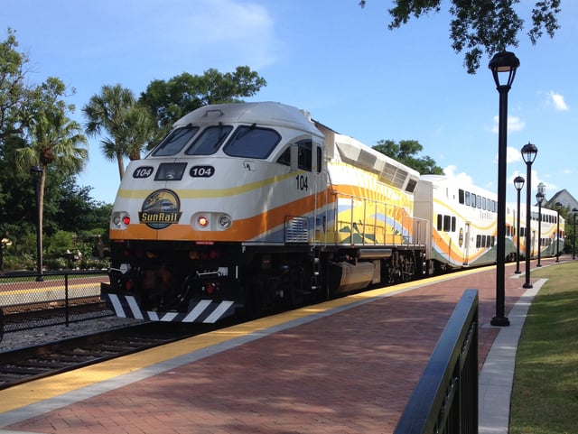 A southbound SunRail train leaving Winter Park Station