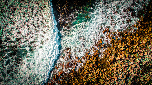 Wave breaking on the rocky beach of Kommetjie