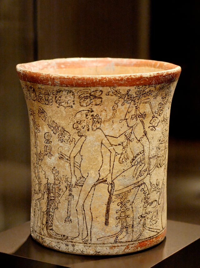 Maya vase depicting a lord of the underworld stripped of clothes and headgear by the young maize divinity.